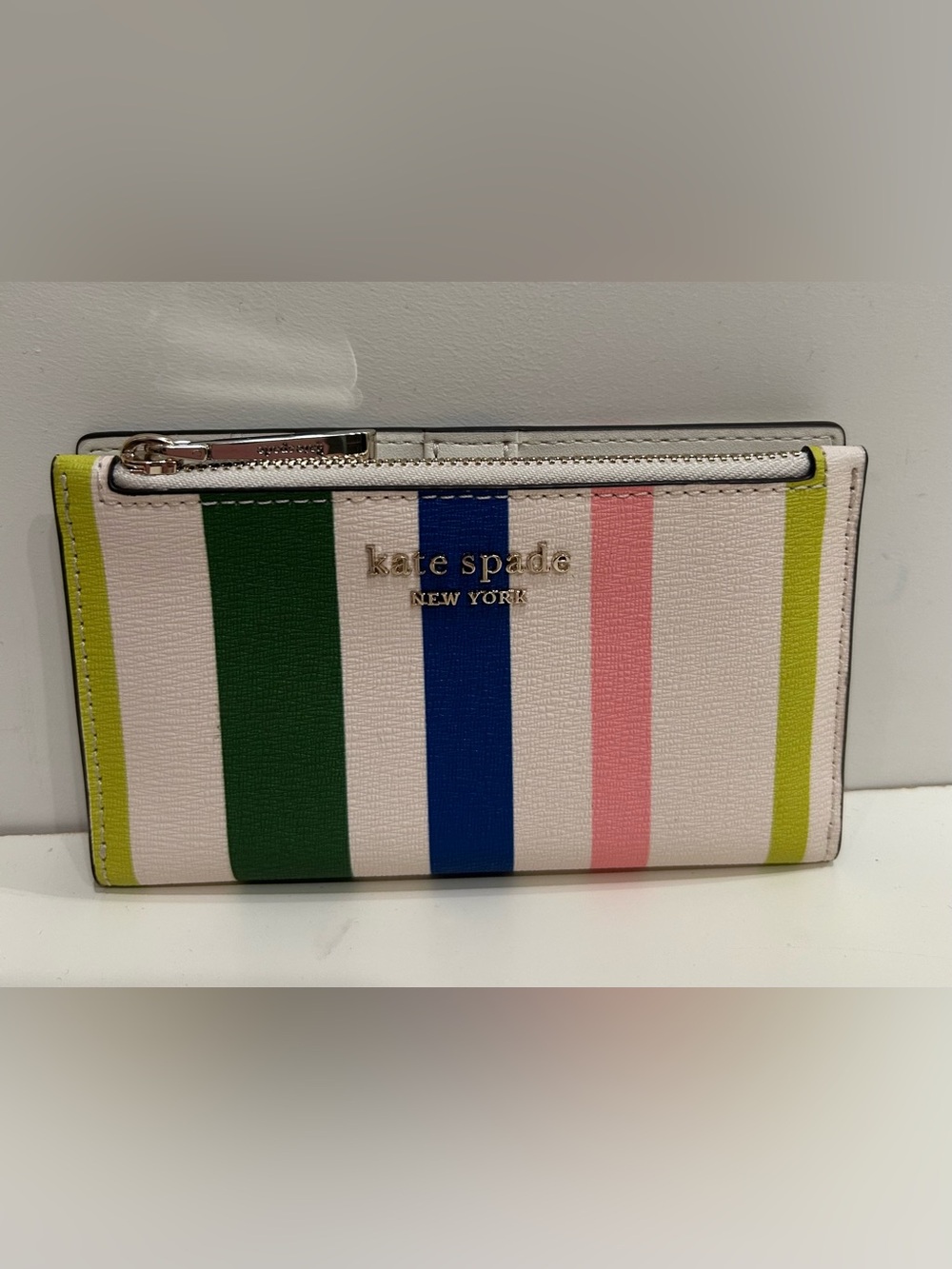 KATE SPADE. Bradley Breezy Stripe Leather Bifold Wallet In Parchment Multi, NWOT